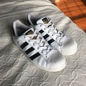 ADIDAS Superstars with gold tongue